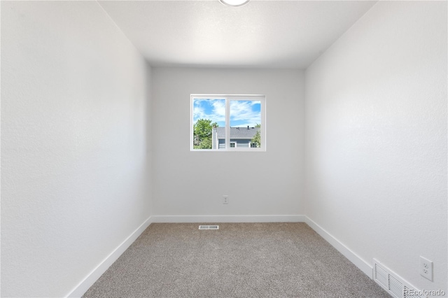 1705 Cathay Ct, Aurora, CO 80011 - spare room featuring light colored carpet and baseboards