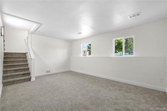 1705 Cathay Ct, Aurora, CO 80011 - spare room featuring carpet and stairs