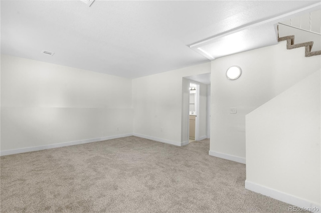 1705 Cathay Ct, Aurora, CO 80011 - additional living space with light colored carpet and stairway