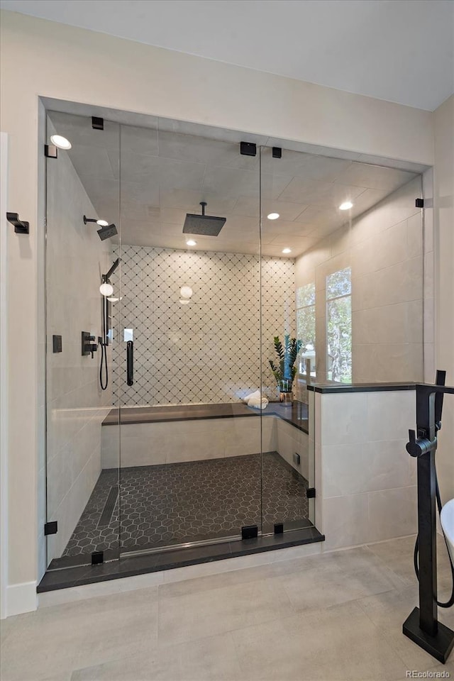 bathroom with a shower with shower door