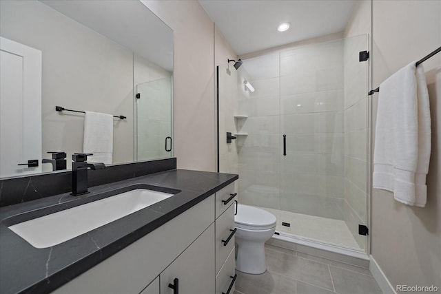 bathroom featuring vanity, toilet, tile patterned floors, and an enclosed shower