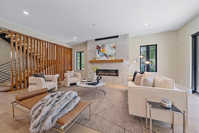 living room featuring light hardwood / wood-style floors and a fireplace