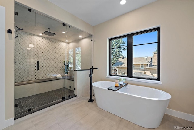 bathroom featuring separate shower and tub and tile patterned floors