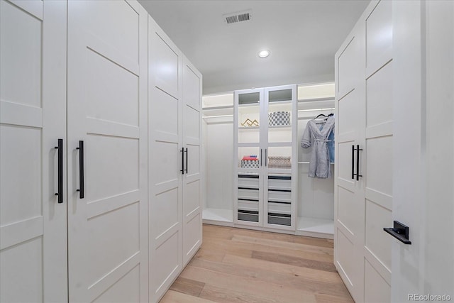 walk in closet featuring light wood-type flooring