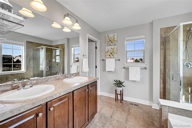 bathroom featuring plenty of natural light and a shower with shower door