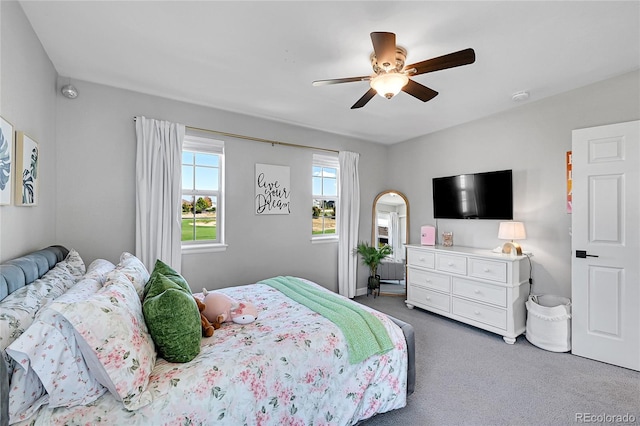 carpeted bedroom with ceiling fan