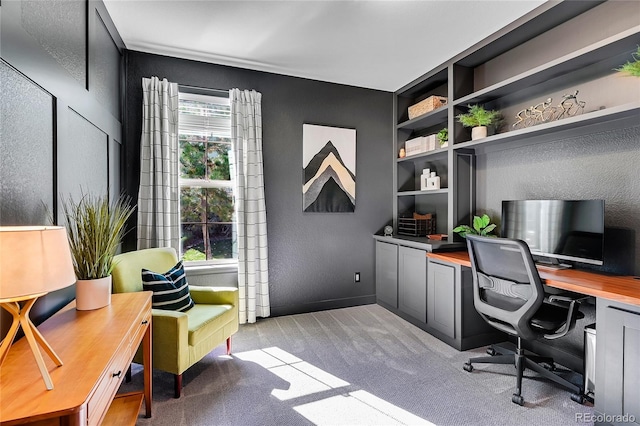 office with built in shelves and light colored carpet