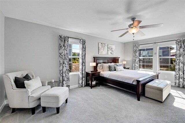 carpeted bedroom featuring ceiling fan