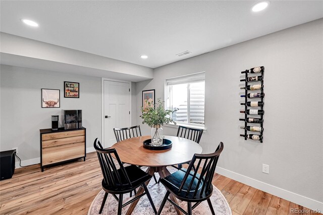 dining space with light wood-type flooring