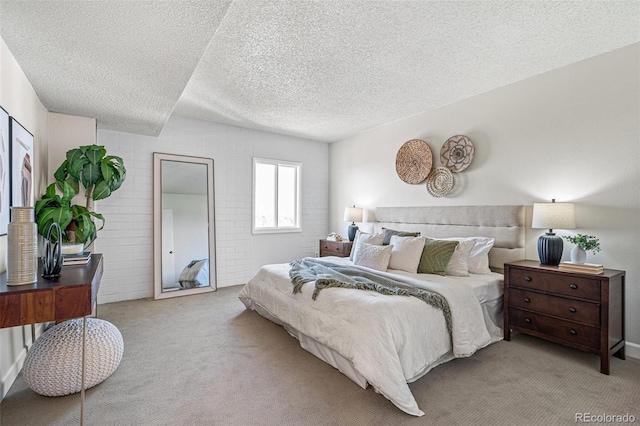 carpeted bedroom featuring a textured ceiling