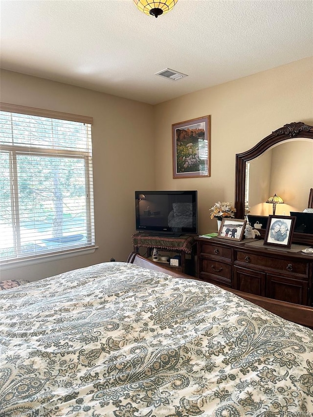 bedroom featuring a textured ceiling