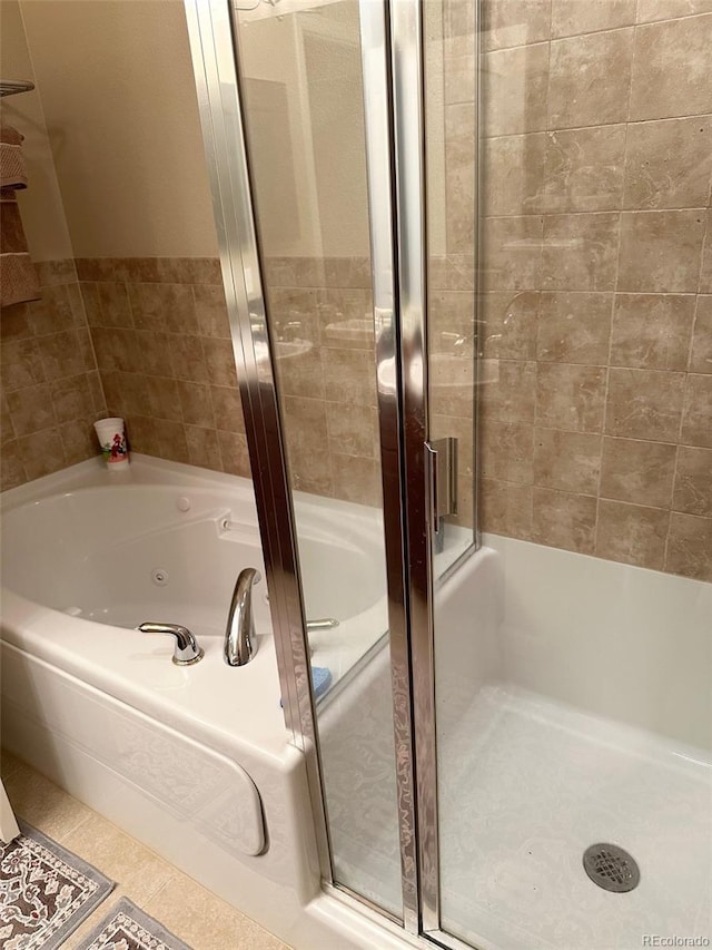 bathroom featuring shower with separate bathtub and tile patterned floors