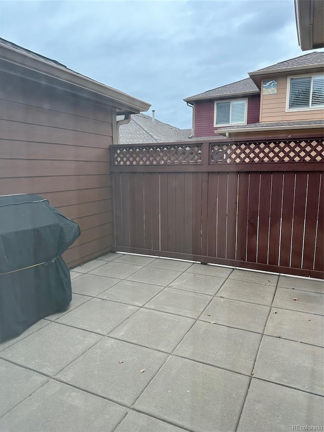 view of patio featuring a grill