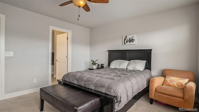 bedroom with ceiling fan and light carpet