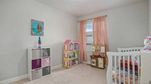 carpeted bedroom with a crib