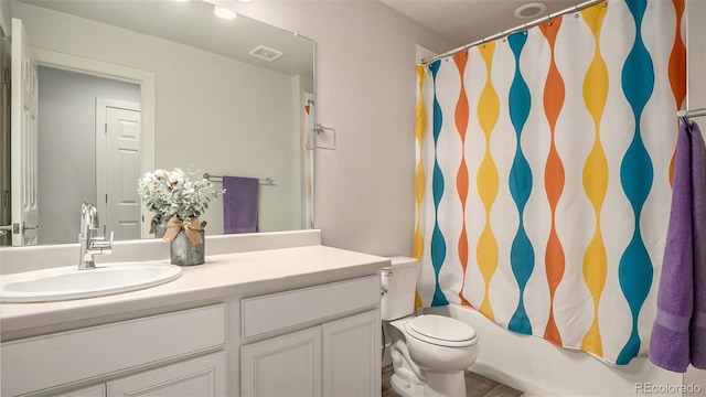 full bathroom featuring vanity, toilet, and shower / bath combo with shower curtain