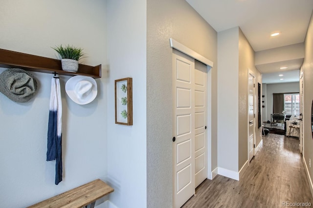 mudroom featuring recessed lighting, baseboards, and wood finished floors