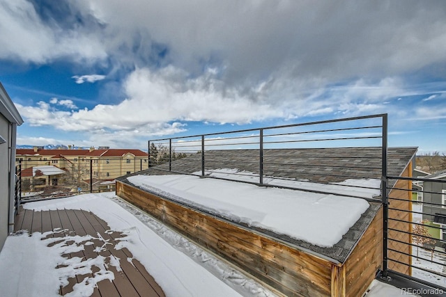 view of snow covered deck