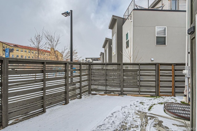 snow covered gate with fence