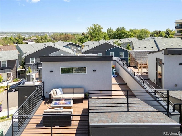 2804 W 53rd Ave, Denver, CO 80221 - deck featuring an outdoor fire pit and a residential view