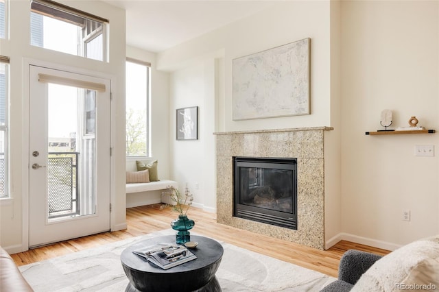 2680 Blake St Unit 12, Denver, CO 80205 - living room with wood finished floors, a fireplace, and baseboards