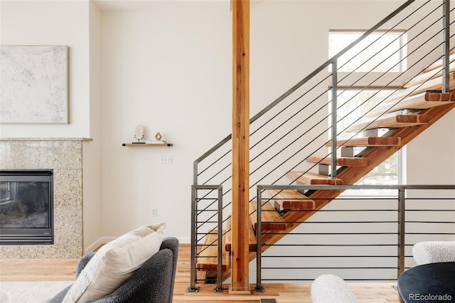2680 Blake St Unit 12, Denver, CO 80205 - stairs with wood finished floors, a fireplace, and baseboards