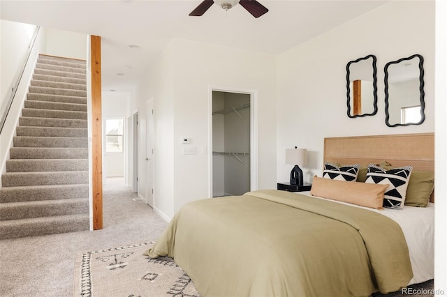 2680 Blake St Unit 12, Denver, CO 80205 - bedroom featuring carpet floors, baseboards, a spacious closet, a ceiling fan, and a closet
