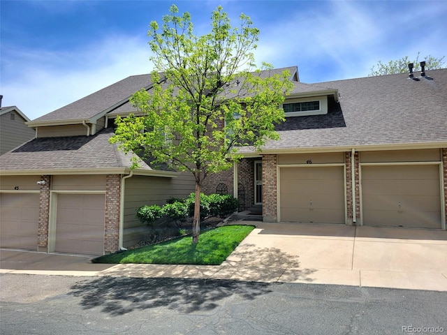 1470 S Quebec Way Unit 46, Denver, CO 80231 - townhome / multi-family property with brick siding and roof with shingles