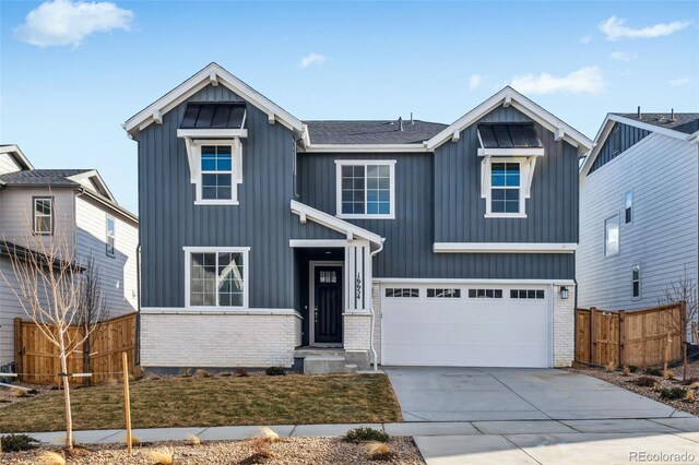 16654 W 93rd Way, Arvada, CO 80007 - modern farmhouse featuring fence, board and batten siding, an attached garage, driveway, and brick siding
