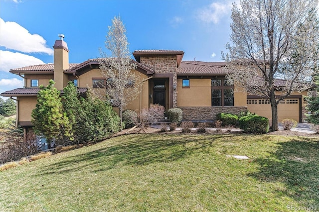 7850 Vallagio Ln, Englewood, CO 80112 - mediterranean / spanish-style house featuring stucco siding, a tile roof, a front yard, a chimney, and stone siding