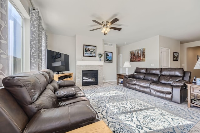 living room featuring hardwood / wood-style flooring and ceiling fan