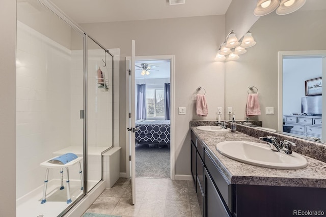 bathroom with walk in shower, tile patterned flooring, vanity, and ceiling fan