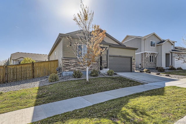 view of front of home featuring a garage and a front yard