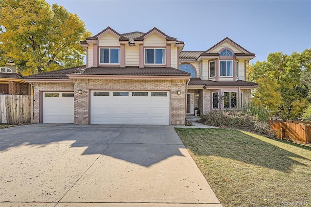 view of front of home featuring a garage and a front lawn