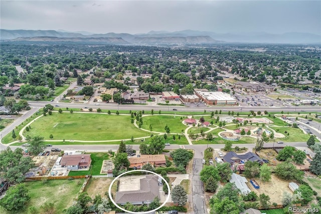 birds eye view of property featuring a mountain view