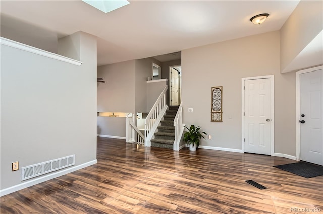 8432 S Upham Way, Littleton, CO 80128 - foyer with stairway, wood finished floors, and a skylight