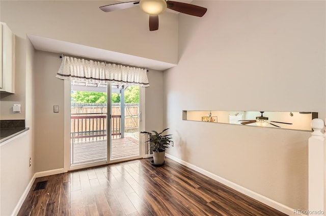 8432 S Upham Way, Littleton, CO 80128 - unfurnished dining area with a ceiling fan and dark wood-style floors