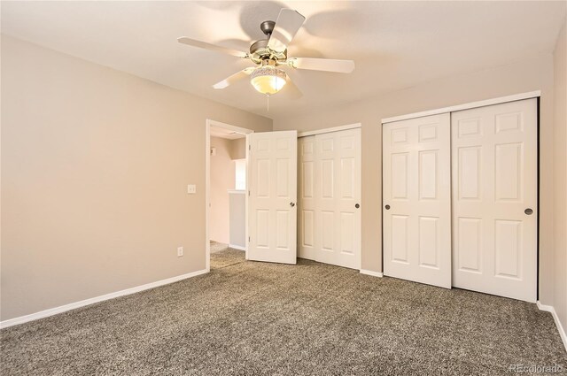 8432 S Upham Way, Littleton, CO 80128 - unfurnished bedroom with multiple closets, carpet, and ceiling fan