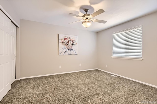 8432 S Upham Way, Littleton, CO 80128 - unfurnished bedroom with a closet, carpet flooring, and a ceiling fan