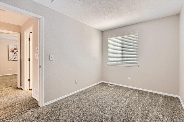8432 S Upham Way, Littleton, CO 80128 - empty room featuring carpet and a textured ceiling