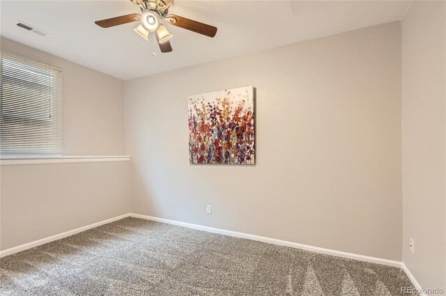 8432 S Upham Way, Littleton, CO 80128 - carpeted spare room with a ceiling fan and healthy amount of natural light