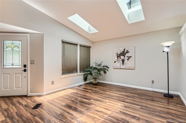 8432 S Upham Way, Littleton, CO 80128 - entrance foyer featuring a skylight, vaulted ceiling, and wood finished floors