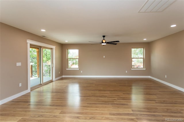 empty room featuring light wood-type flooring and ceiling fan