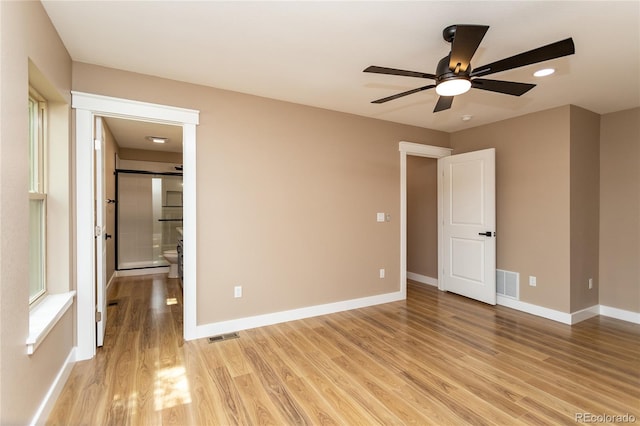 unfurnished room featuring ceiling fan and light wood-type flooring