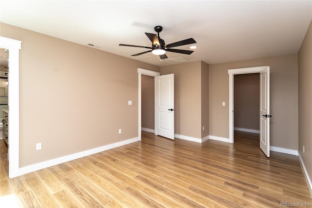 unfurnished bedroom with light wood-type flooring and ceiling fan