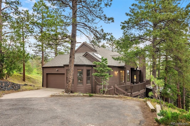 23599 Shingle Creek Rd, Golden, CO 80401 - view of front of house with a shingled roof, driveway, and a garage