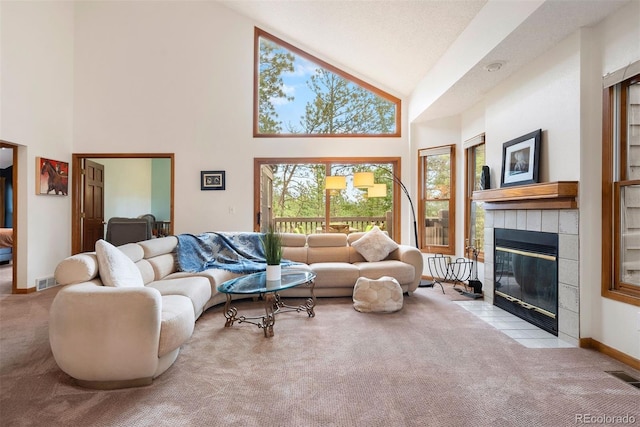 23599 Shingle Creek Rd, Golden, CO 80401 - living room featuring carpet floors, high vaulted ceiling, and a tiled fireplace