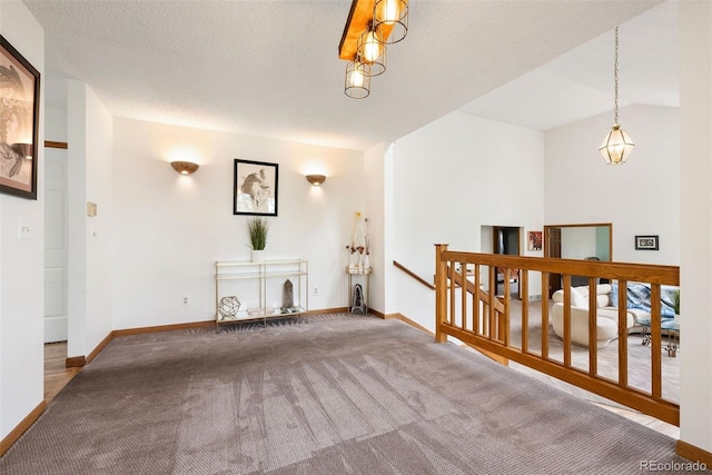23599 Shingle Creek Rd, Golden, CO 80401 - unfurnished living room featuring carpet flooring and baseboards