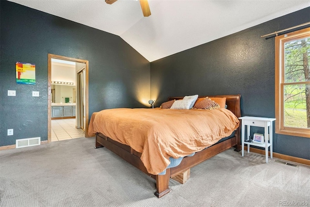 23599 Shingle Creek Rd, Golden, CO 80401 - bedroom with a textured wall, carpet, vaulted ceiling, ensuite bathroom, and ceiling fan