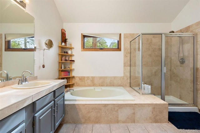 23599 Shingle Creek Rd, Golden, CO 80401 - bathroom featuring a garden tub, vanity, plenty of natural light, a stall shower, and lofted ceiling